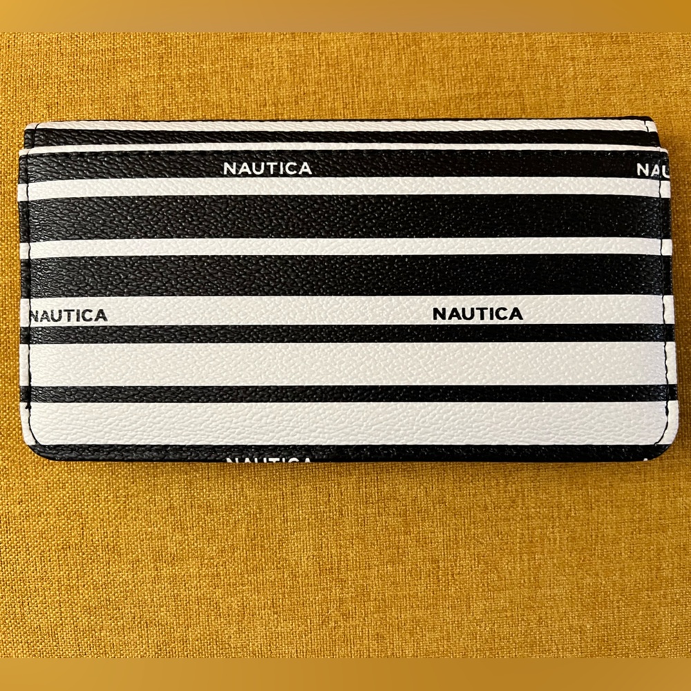 Nautica black and white striped cruelty free faux leather wallet. 7”wide, 4”tall